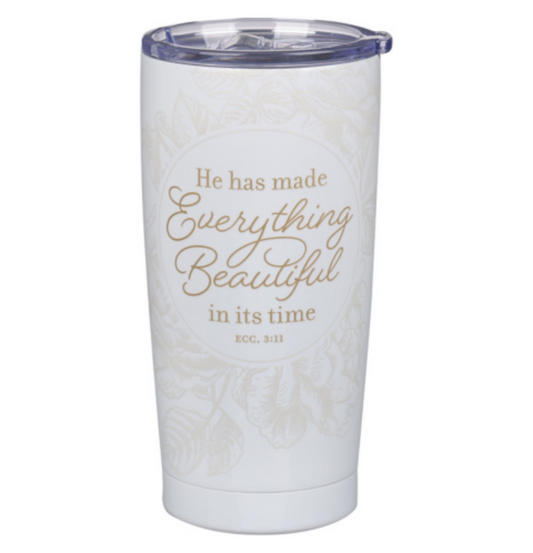 White tumbler with gold text on a white background