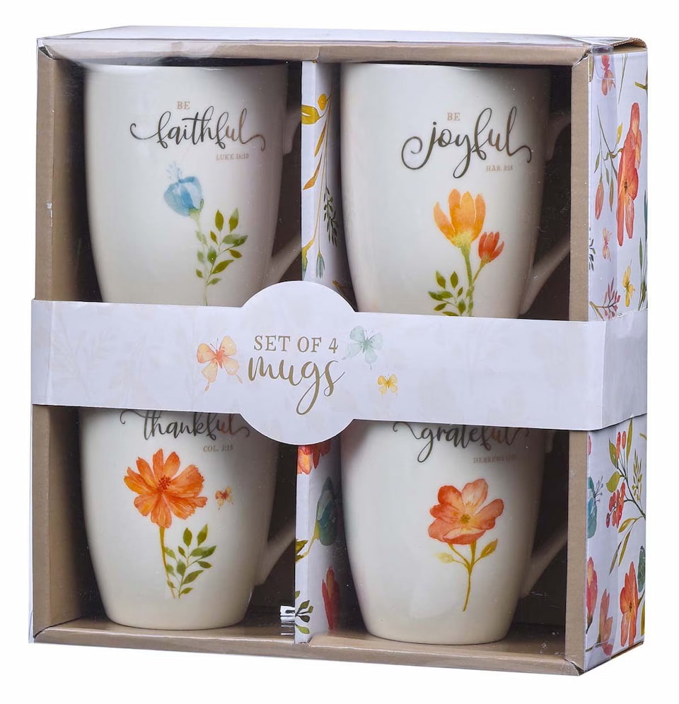 Set of four mugs with floral designs and text in a box packaging.