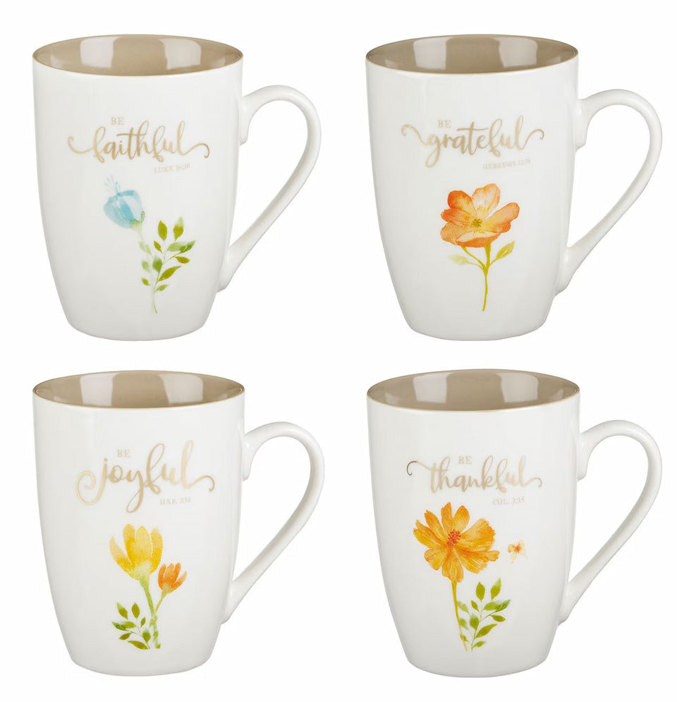 Four mugs with floral designs and text on a white background