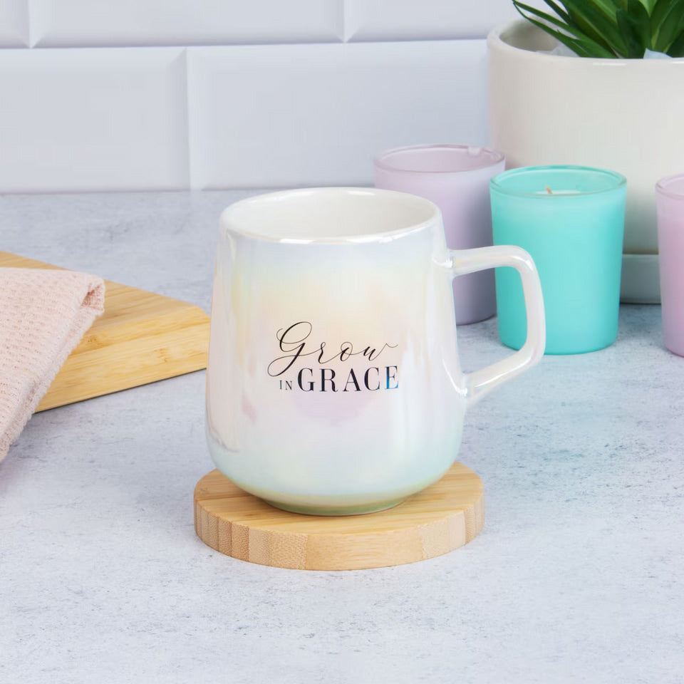 Mug with floral design and 'Grow in Grace' text on a white background