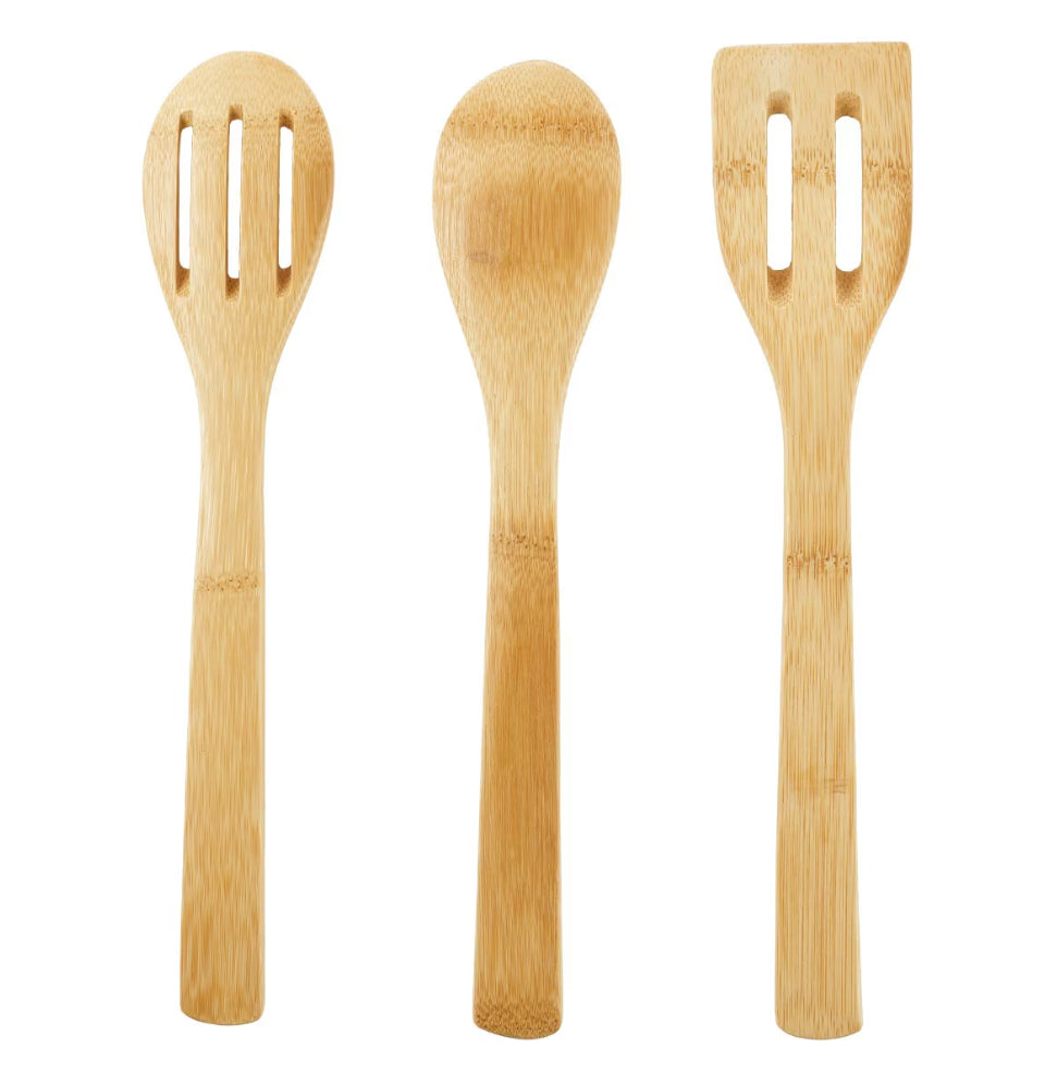 Set of three bamboo kitchen utensils on a white background