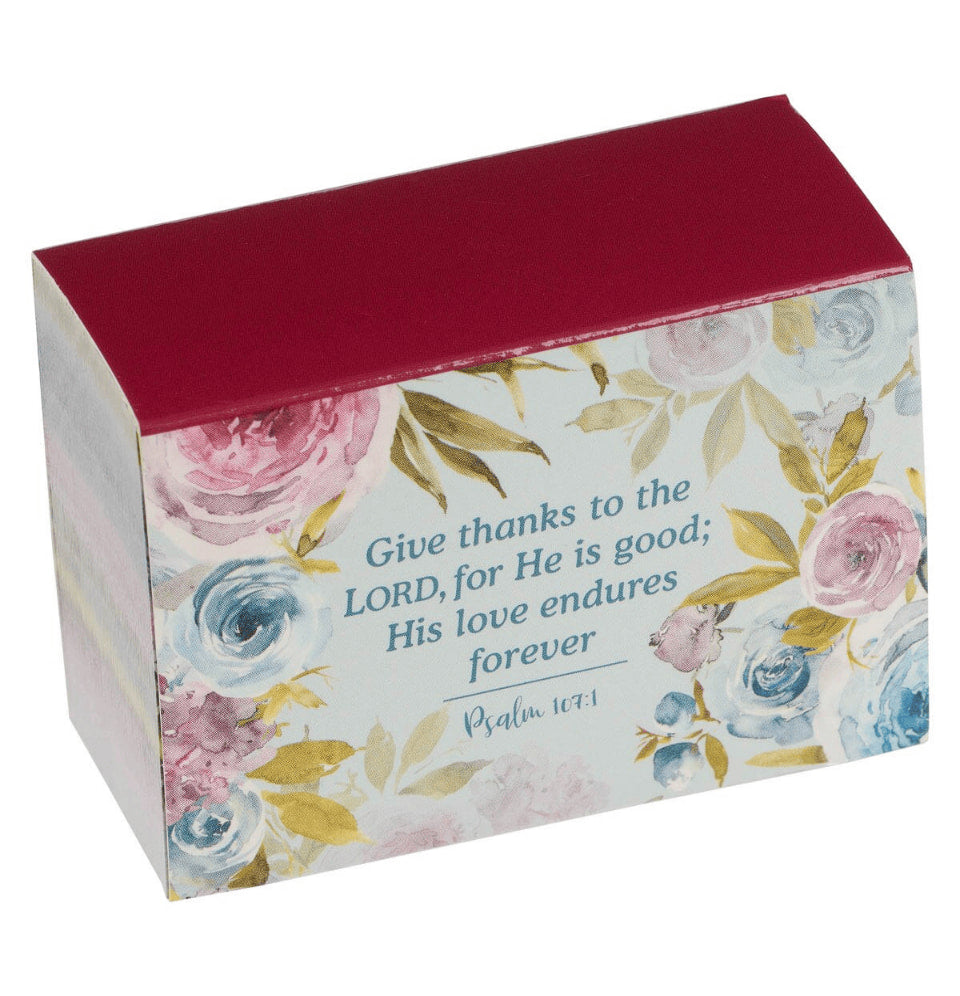 Decorative box with floral design and Bible verse text on a white background