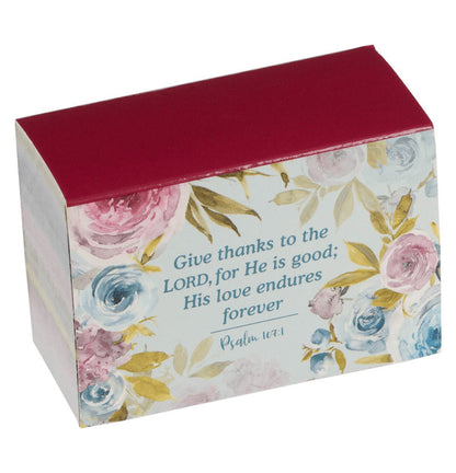 Decorative box with floral design and Bible verse text on a white background