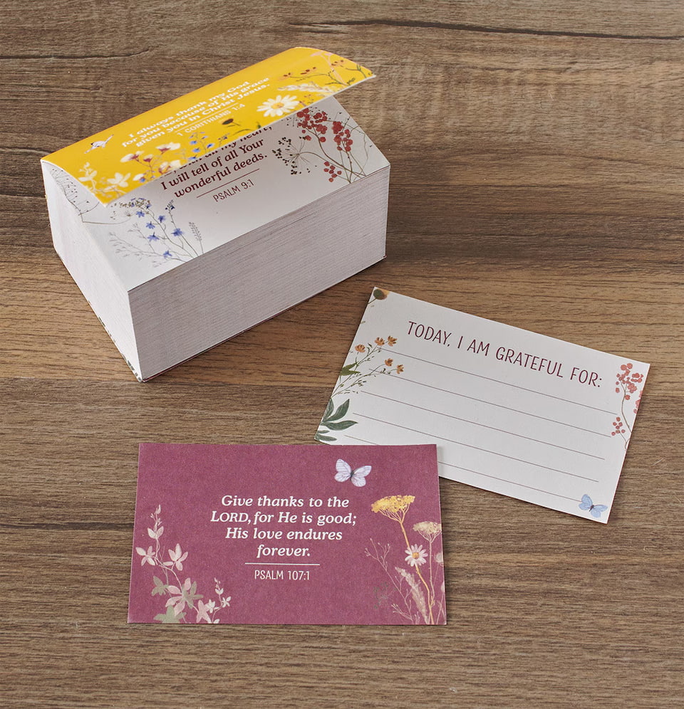 Set of cards with motivational phrases on a wooden surface