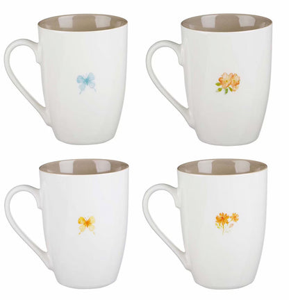 Set of four white mugs with floral designs on a white background
