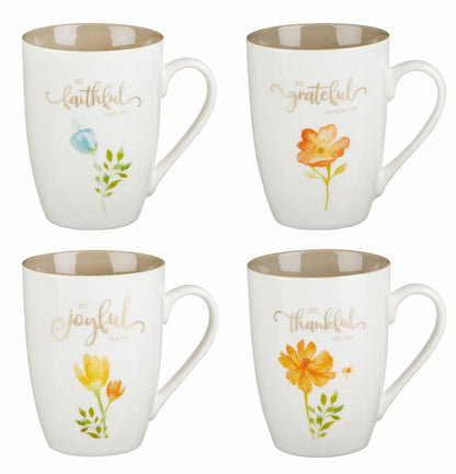 Four mugs with floral designs and text on a white background