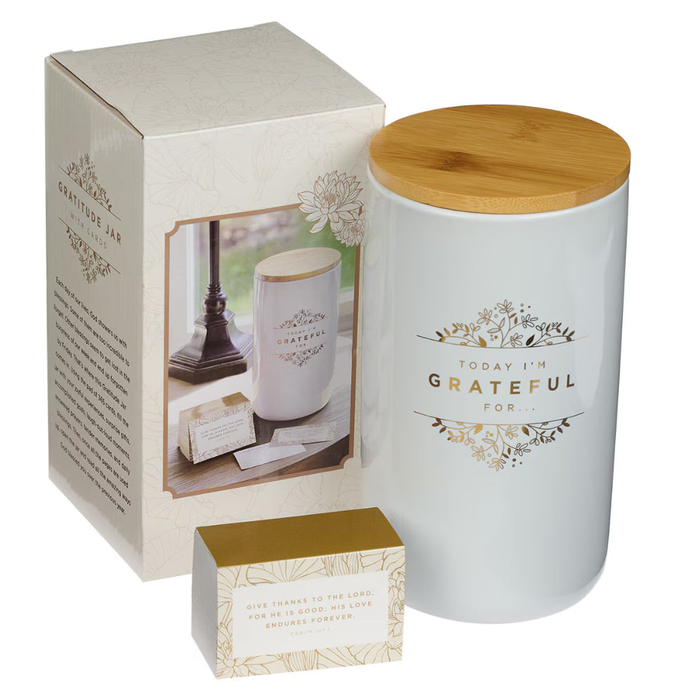 White jar with wooden lid and 'Today I'm Grateful' text, alongside packaging on a white background