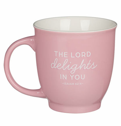Pink mug with 'The Lord delights in you' text on a white background