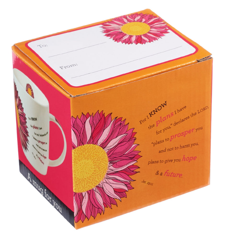 Gift box with floral design and inspirational text on a white background