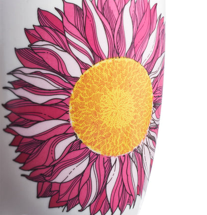 Close-up of a pink and yellow floral design on a white background