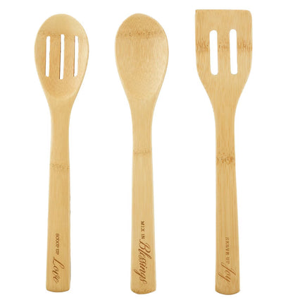 Three wooden utensils with slots on a white background
